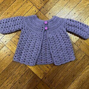 Adorable hand-made purple sweater.